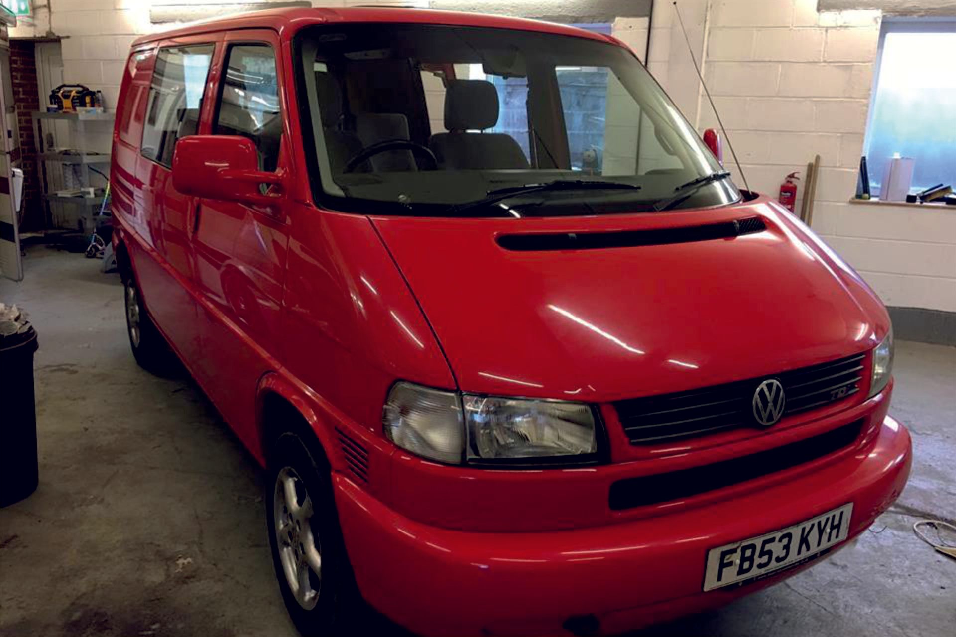 red t 4 Volkswagen camper van named Triumph
