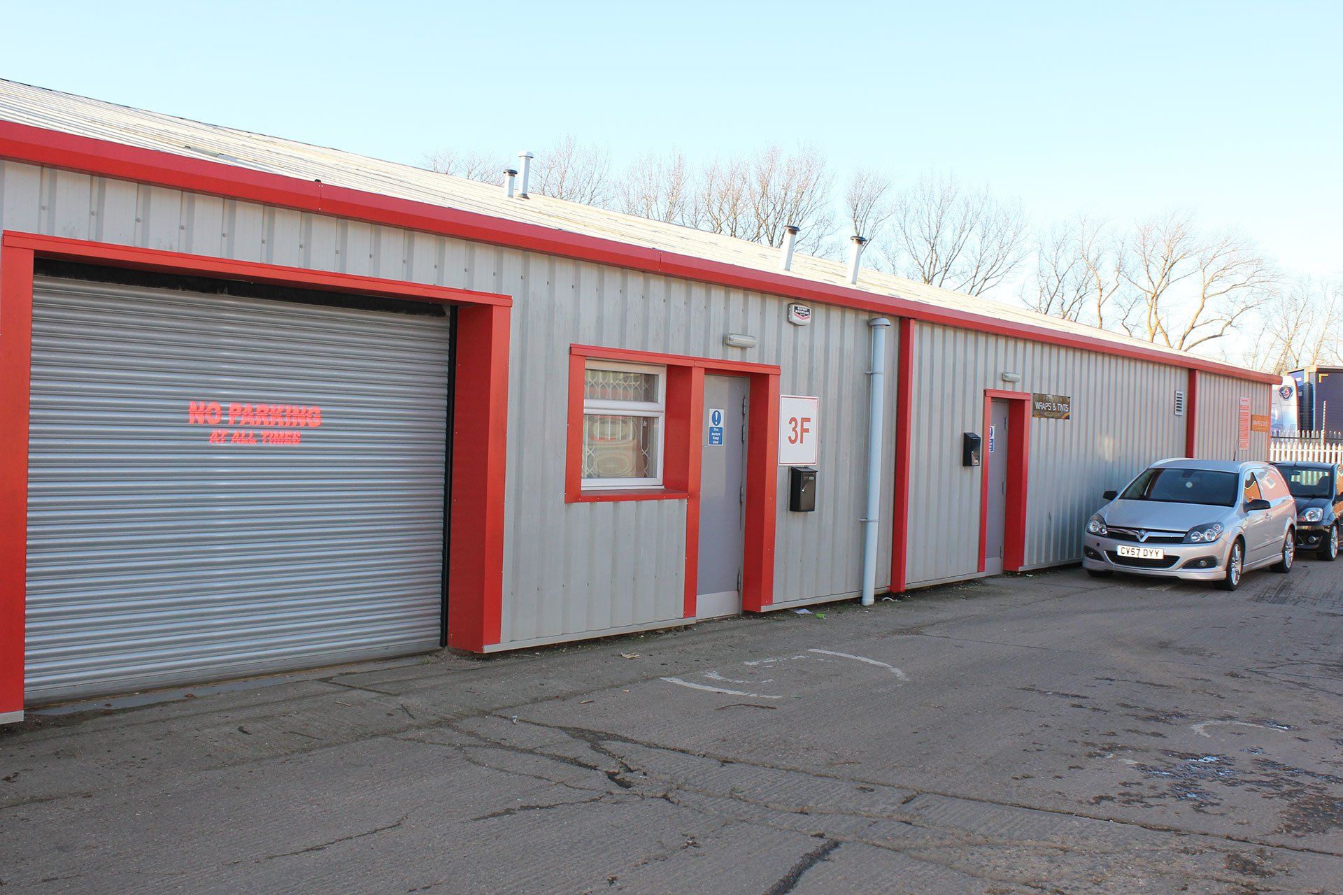 front of warehouse with an open entrance