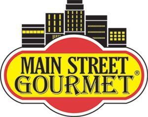 A logo for main street gourmet with a city skyline in the background