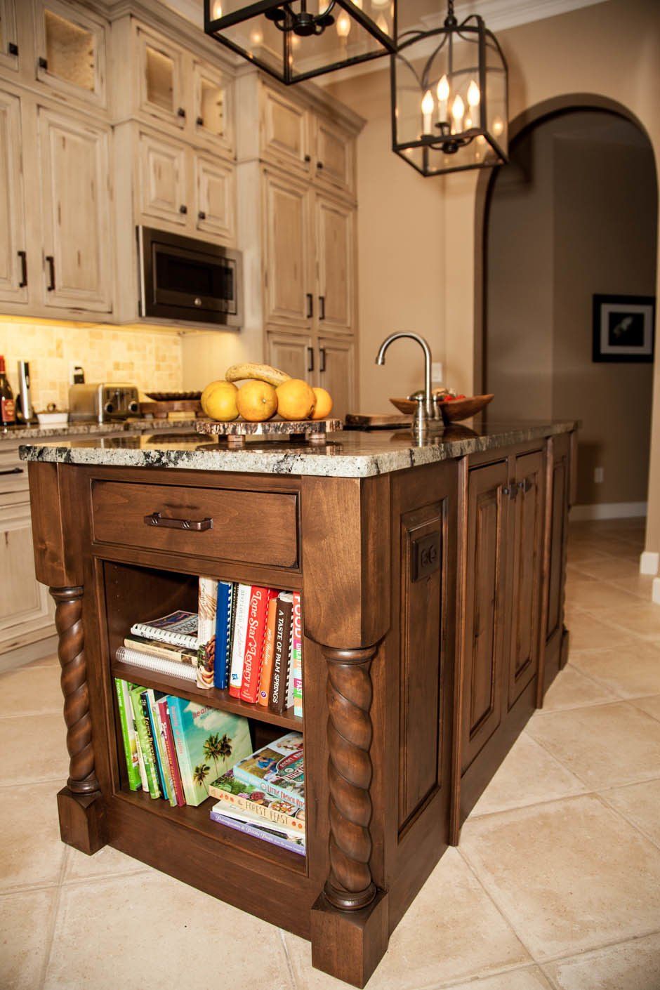 Cozy traditional kitchen remodel with weathered light stained inset raised panel cabinetry.