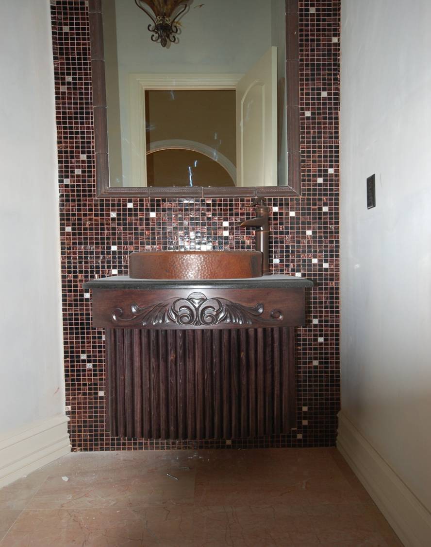 Elegant and timeless farmhouse style standalone vanity with vessel sink and tile backsplash.