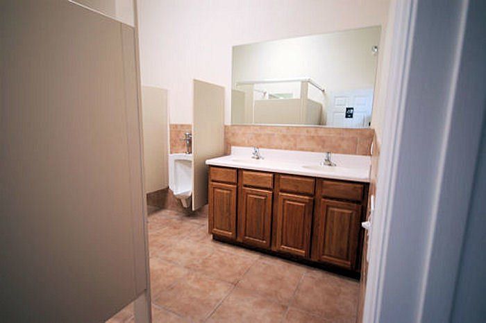 Commercial bathroom vanity remodeling project, complete with new bathroom partitions.