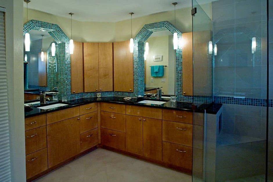Turquoise small wall tile accenting slab bathroom vanity cabinetry. Master bath remodel.