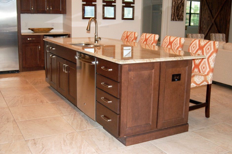 Very functional island with drawers. Dark stained shaker doors with slab drawer fronts.