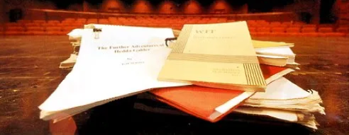 Stack of scripts on stage