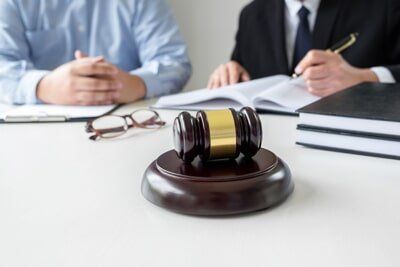 Attorney and Client with Judge`s Gavel In front — Miami Attorney in Miami, FL Attorney and Client with Judge`s Gavel In front — Miami Attorney in Miami, FL