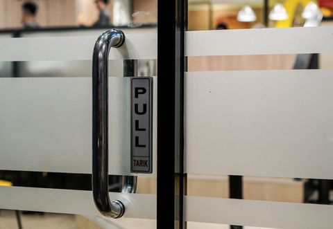 A Metal Handle of a Glass Door — Laramie, WY — Snowy Range Glass A Metal Handle of a Glass Door — Laramie, WY — Snowy Range Glass