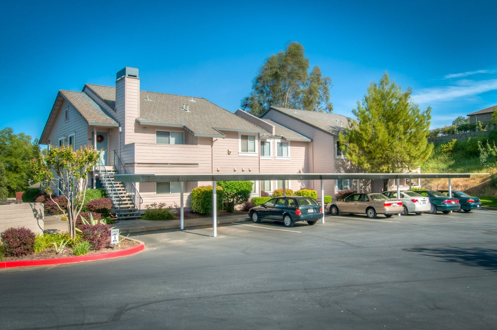 A view of the complex from further away showing parking as well