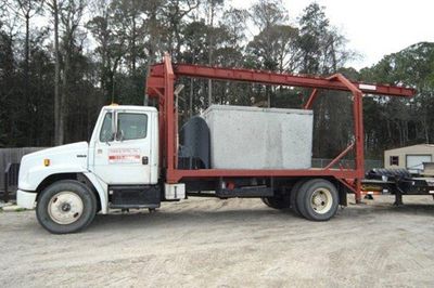Septic Tank On A Open Trailer Truck — Panama City, FL — Parker Septic Septic Tank On A Open Trailer Truck — Panama City, FL — Parker Septic