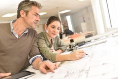 Two architects planning a new start up dental and medical practice
