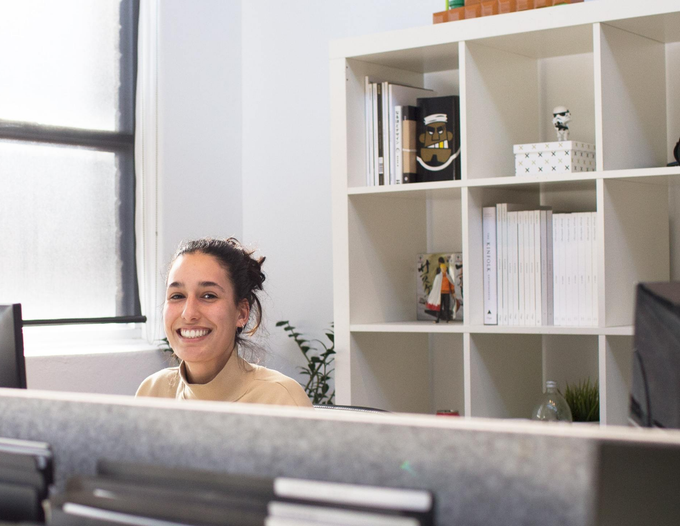 design - build dental office front office with smiling front office person