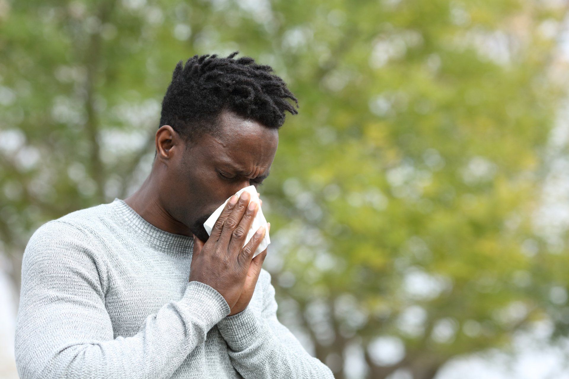 Man Blowing His Nose — Hot Springs, AR — Jackson Allergy & Asthma Clinic