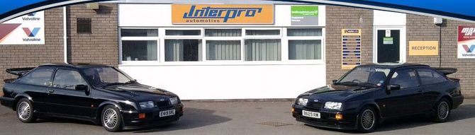 Two cars at opposite at shop front