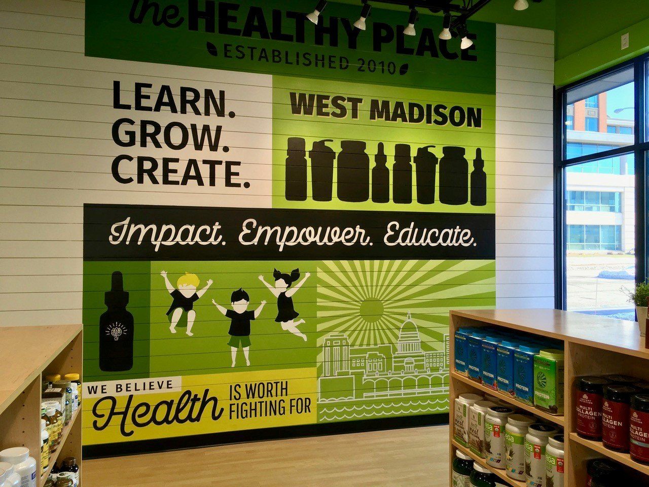Interior wall mural in a store reading 