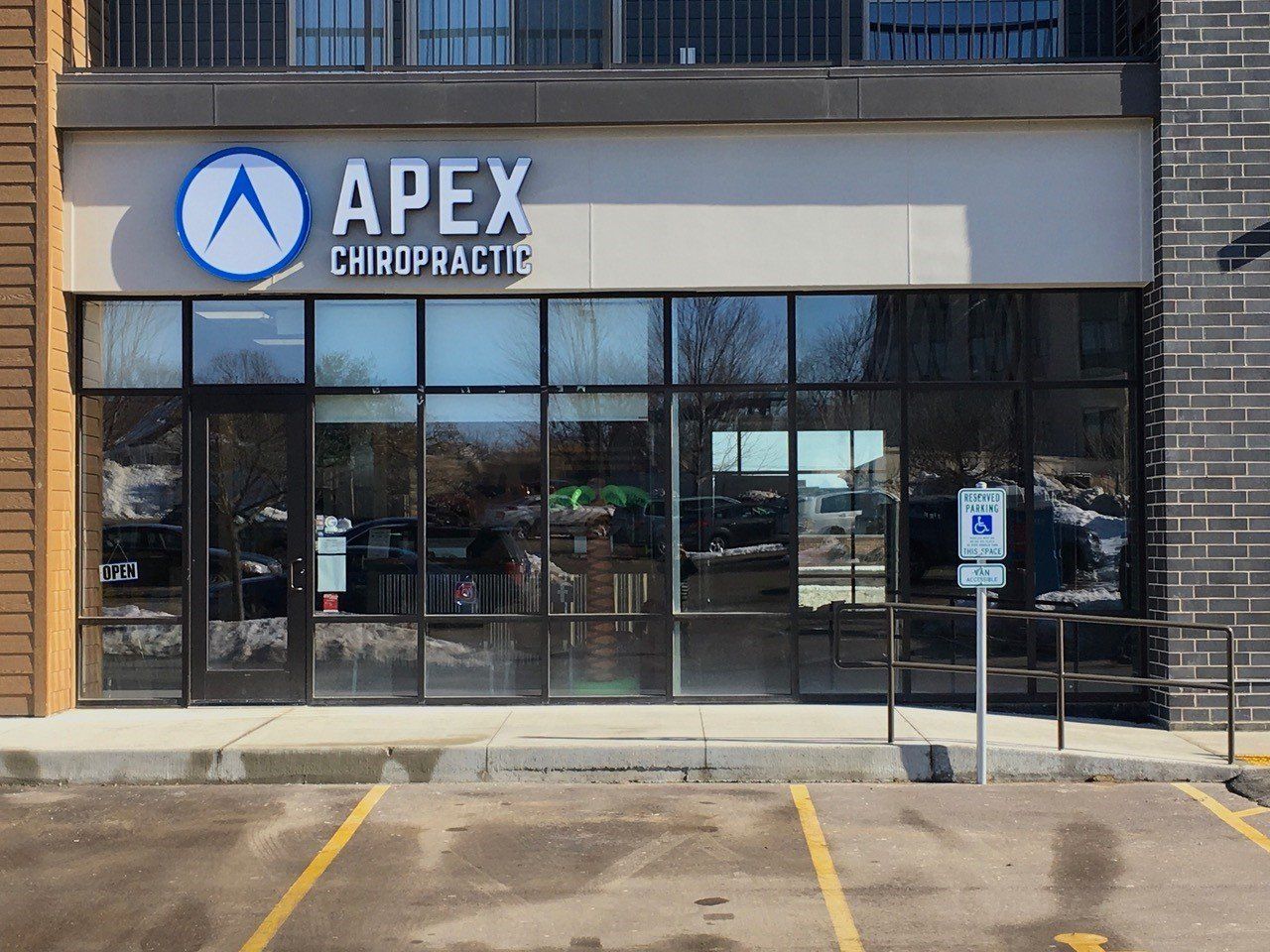 Apex Chiropractic storefront with signage and large windows.