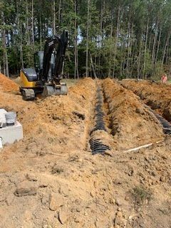 Excavating Septic Drain Field — Rocky Mount, NC — Boswell & Son Septic Tank Service Inc.