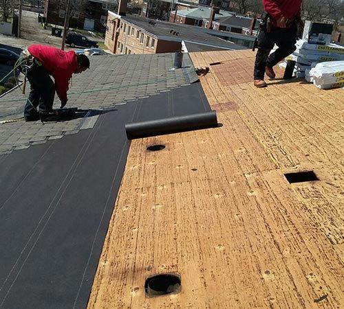 Roof Construction —Workers Working on Roof in Chicago, IL