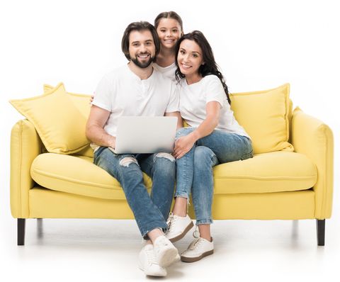 Heating Installation — Family Sitting on a Couch in Gaston, NC Heating Installation — Family Sitting on a Couch in Gaston, NC