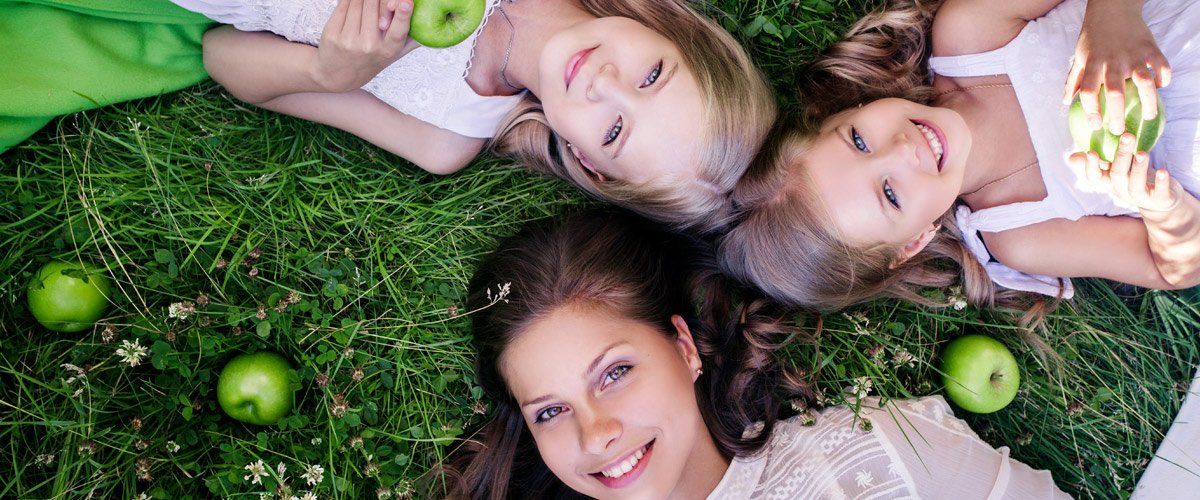 Happy joyful young family having fun in summer park Happy joyful young family having fun in summer park