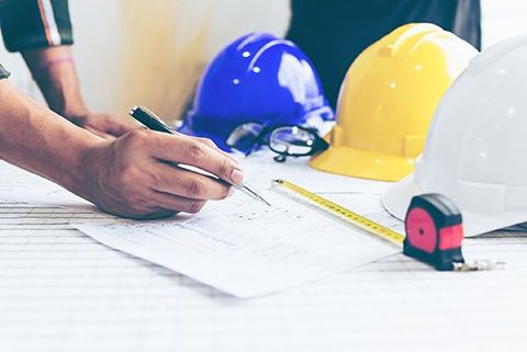 Contact Forensic Engineering — Engineer Working Table with Safety Helmet in  Olympia, WA