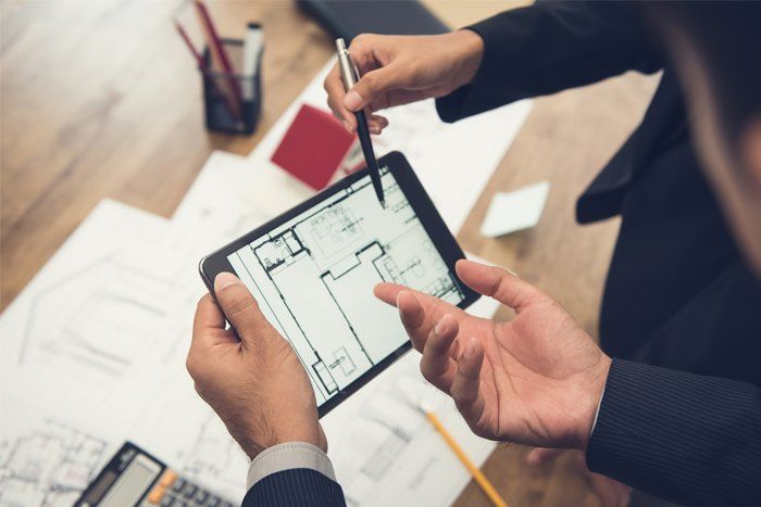 Engineering Consultant — Architect Discussing the Blueprint in Olympia, WA
