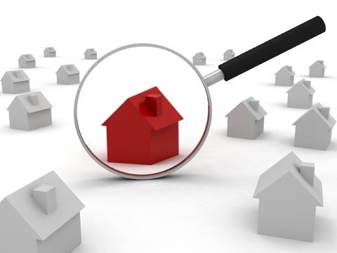 house under magnifying glass