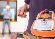 man holding machine