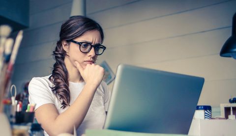 lady looking perplexed at laptop lady looking perplexed at laptop