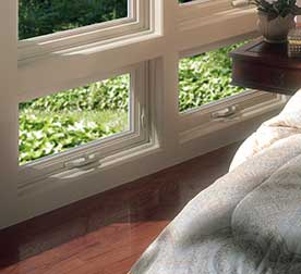 Casement windows set close to a wood floor that slide open Buffalo, NY