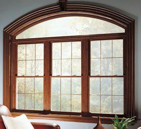 Arched casement window with wood trim Amherst, NY
