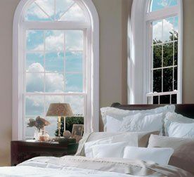 Single window with rounded top and white trim Kenmore, NY