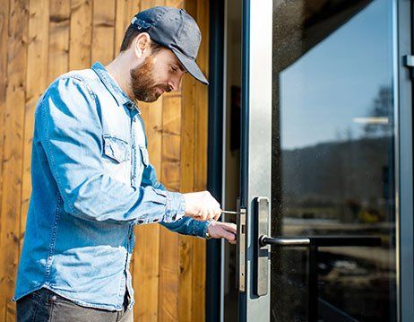 Man Installing New Lock — Chicagoland, IL — AA Phil’s 24 Hour Lock & Key