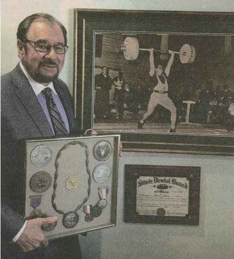 Dentist Dr. James George with Olympic Medals