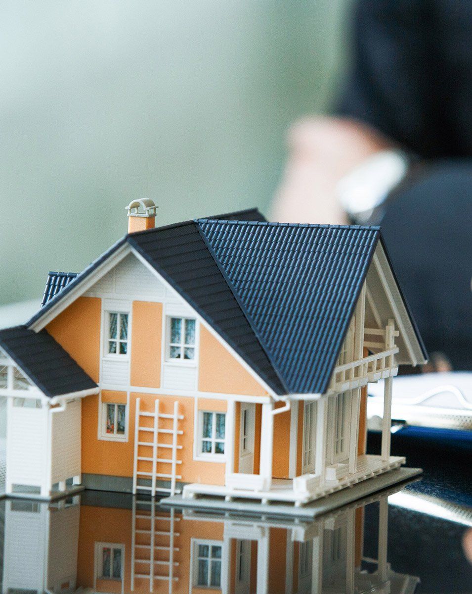 House with people signing agreement | BeachOne Realty
