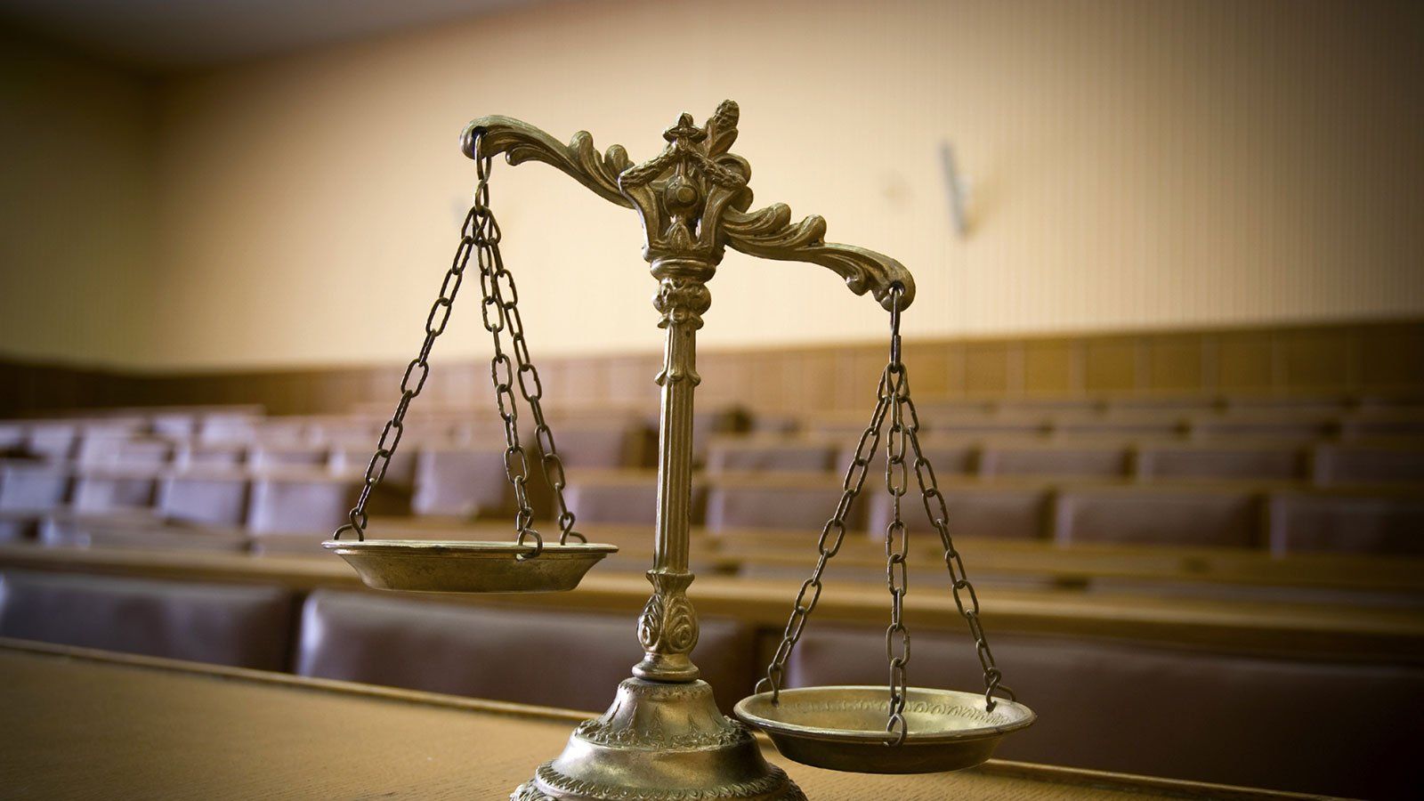 Symbol of law and justice in the empty courtroom