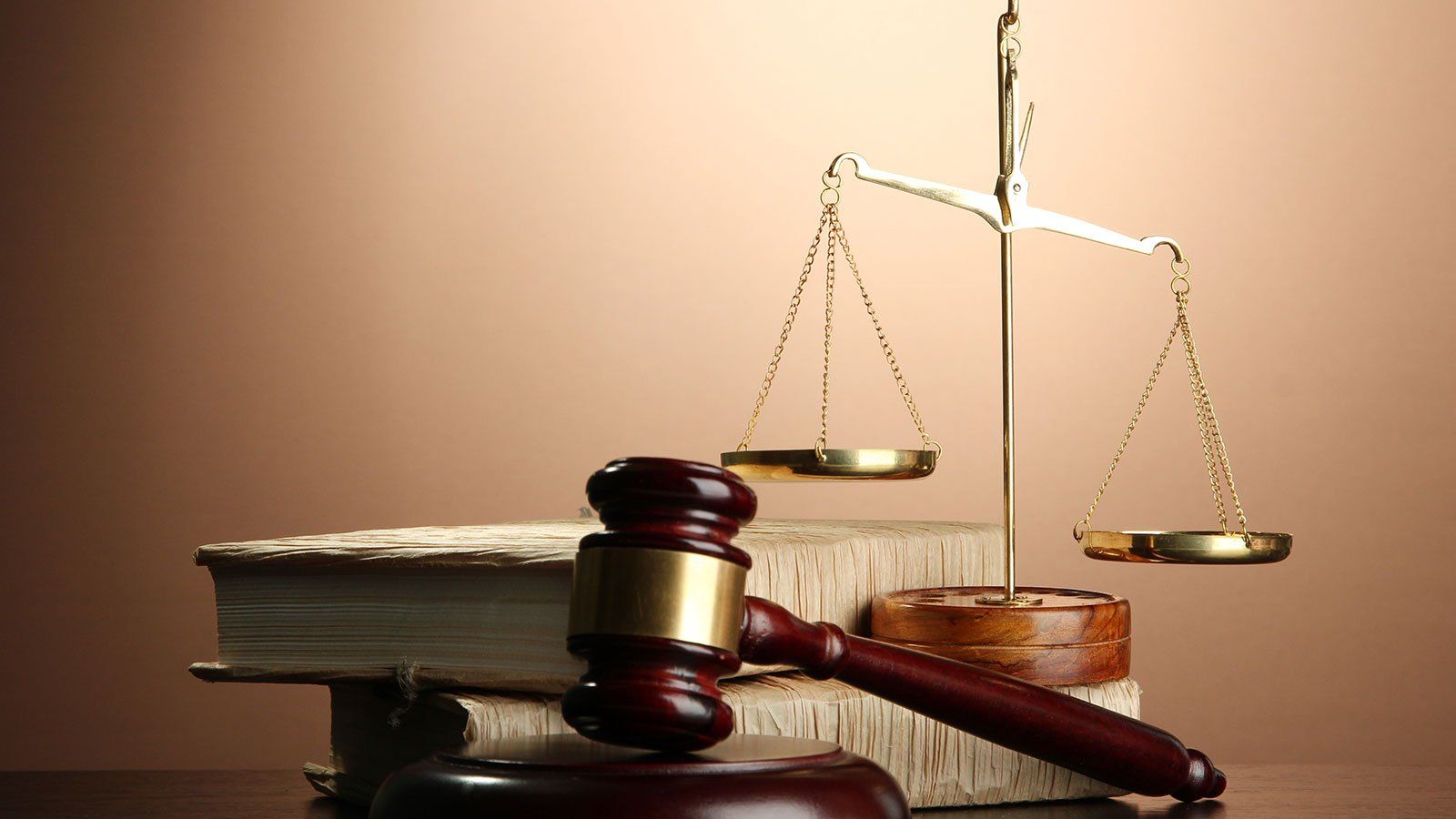 Golden scales of justice, gavel and books