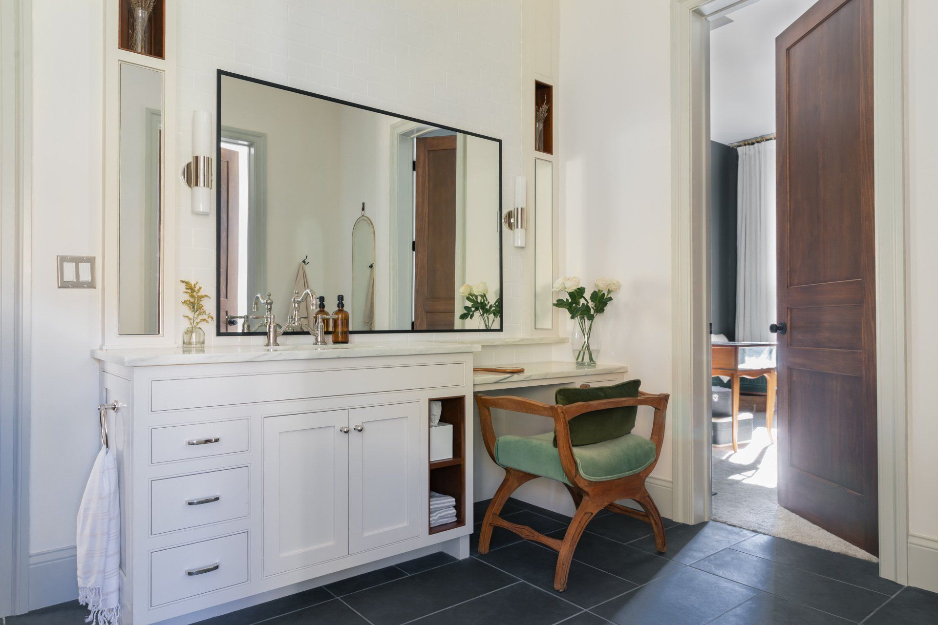 bathroom with white cabinets