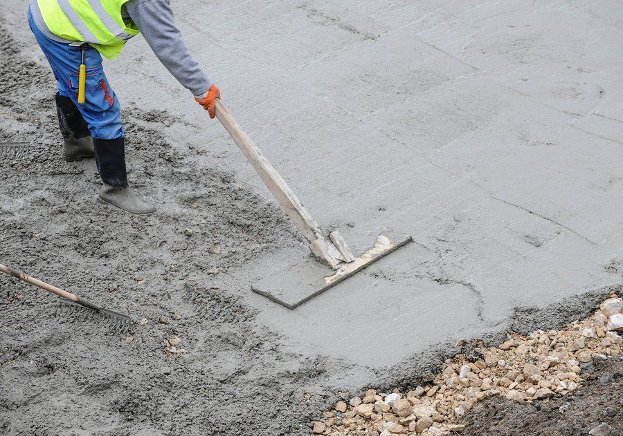 worker paving road in orange county, ca