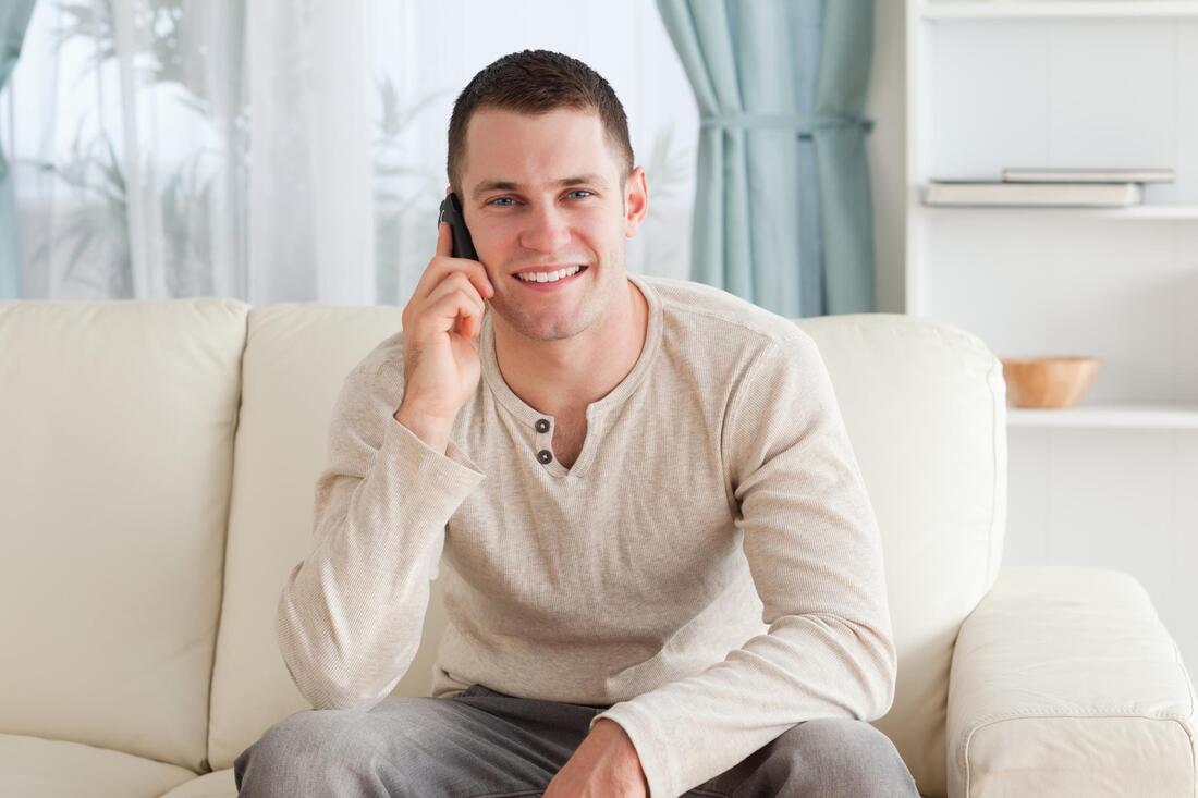 man talking on cellphone in orange county