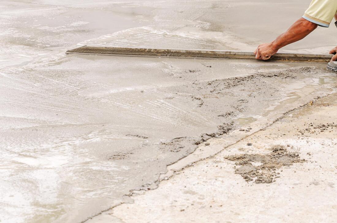 man doing concrete work on floor