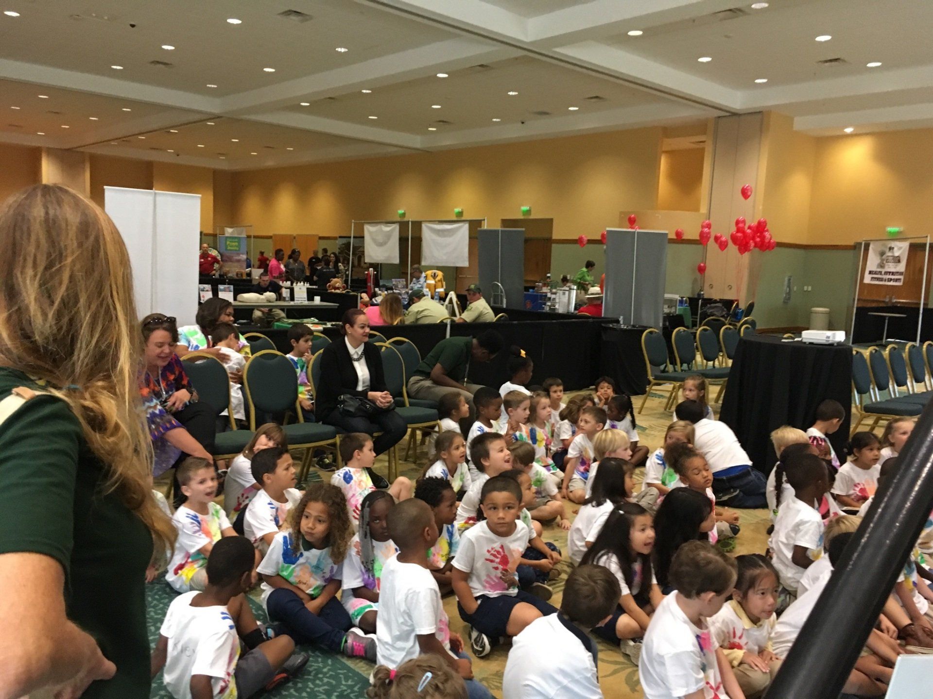 Children getting ready to hear and see a new story from one of the national authors at the Buddy Bear® den main stage