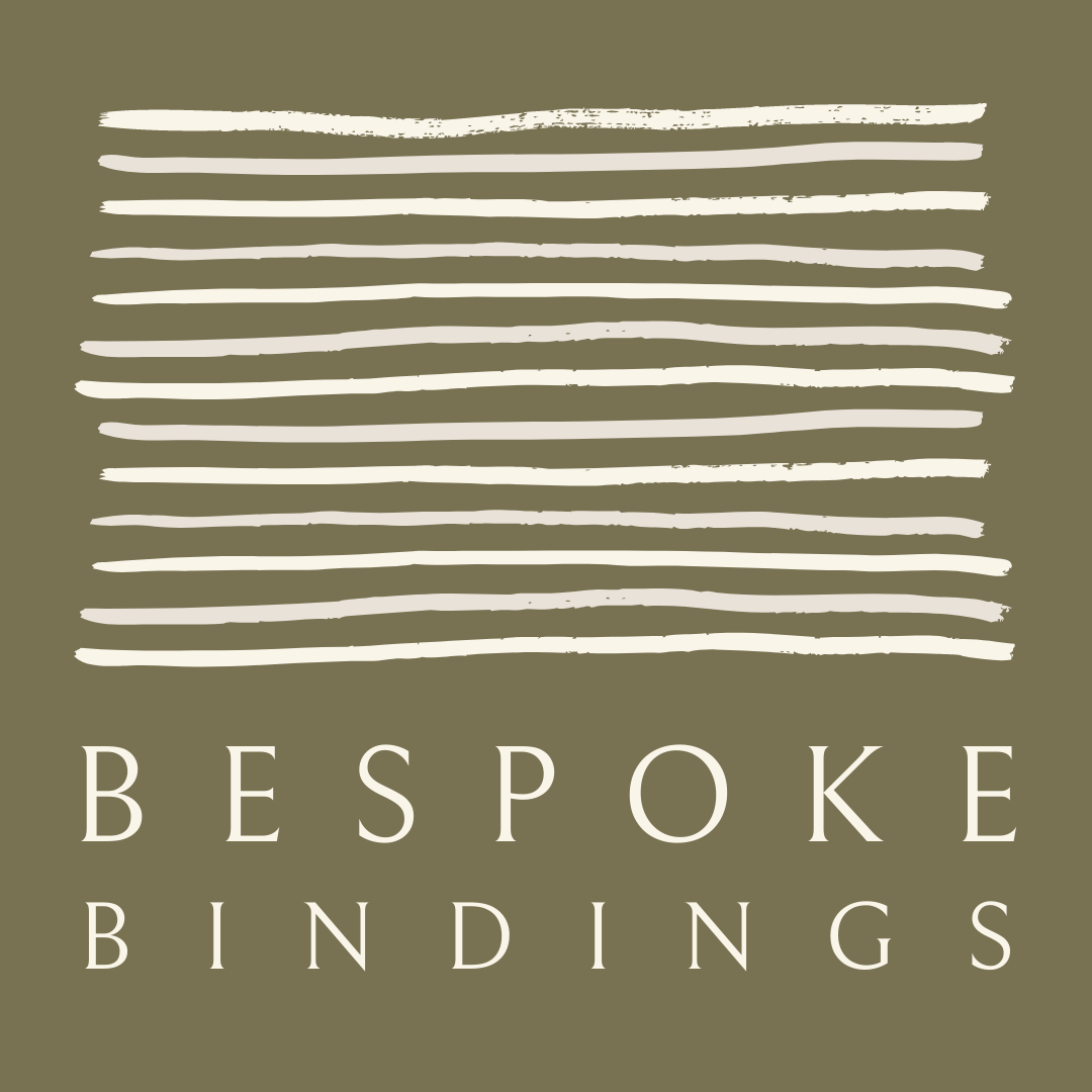 The bespoke Bindings logo which is a soft olive green square with many roughly drawn lines in a light beige colour to appear like pages stacked on top of one another. Beneath the lines is the text Bespoke Bindings, which is in a smart serif font.