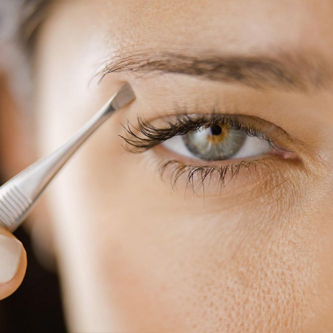 plucking eyebrows