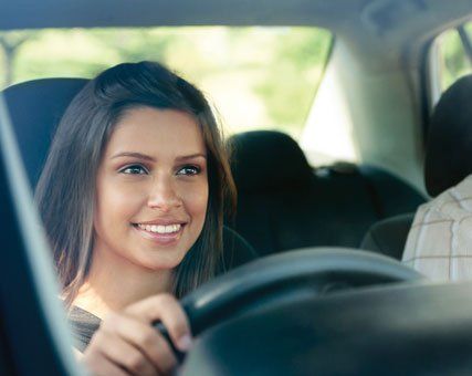 Young girl driving a car