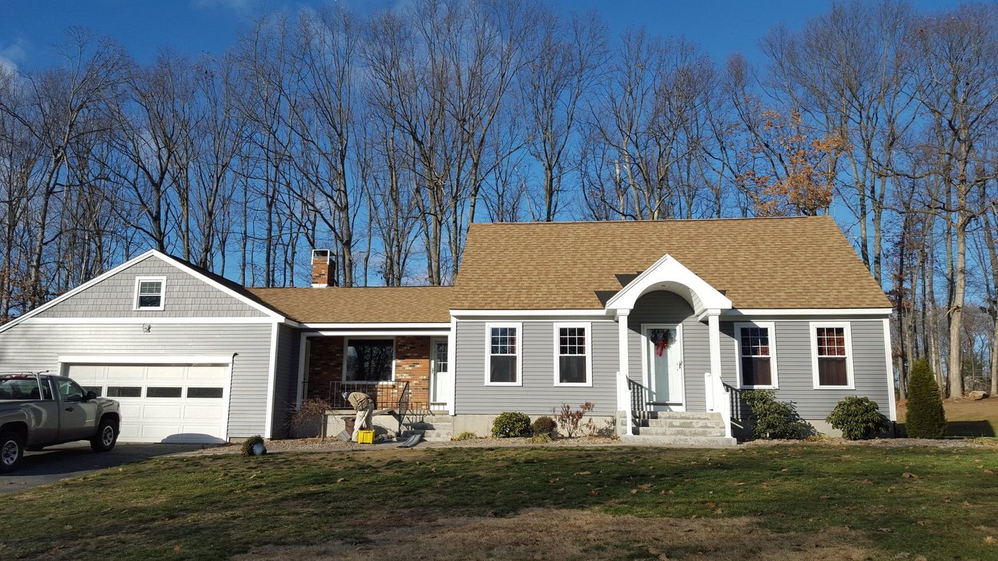 silver grey horizontal vinyl siding installation paired with Azek trim around the windows