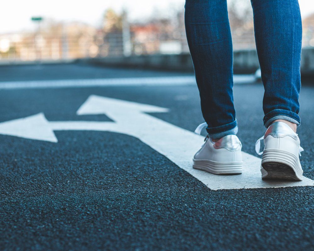 Walking on Directional Sign on Asphalt Road — Fort Collins, CO — Save Mor Self Storage