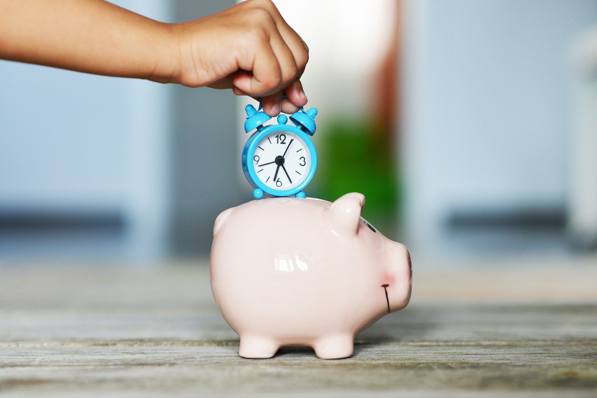 piggy bank with clock on its back