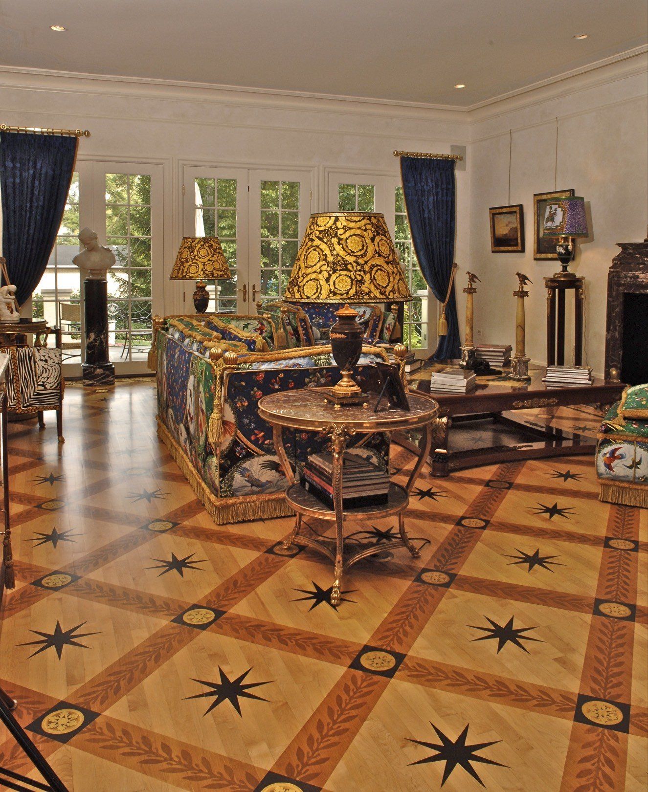 A living room with a wooden floor with stars on it