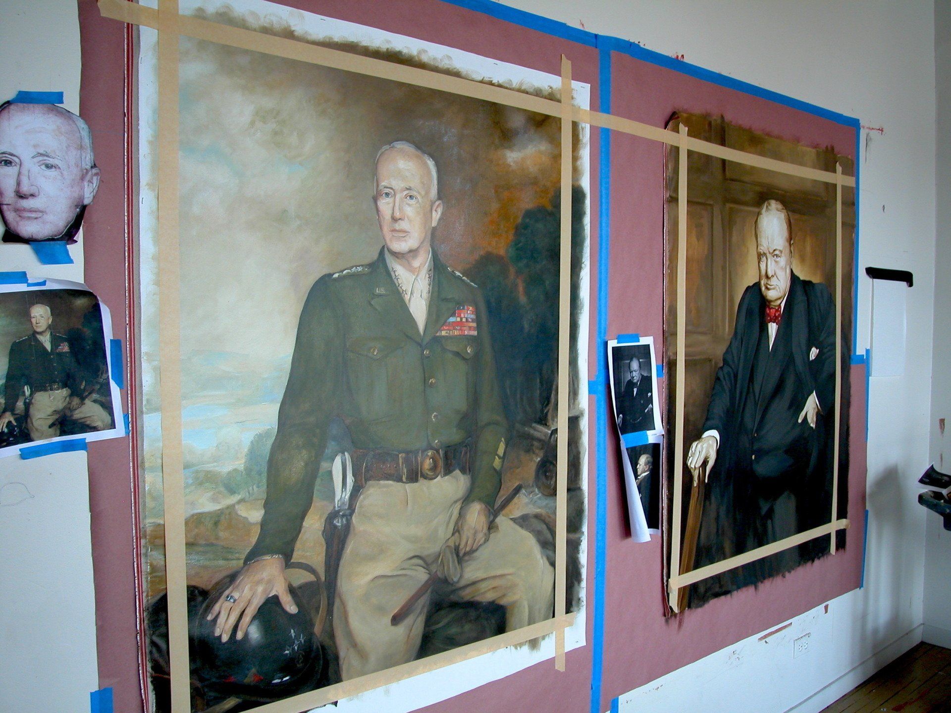 A painting of a man in a military uniform is taped to a wall