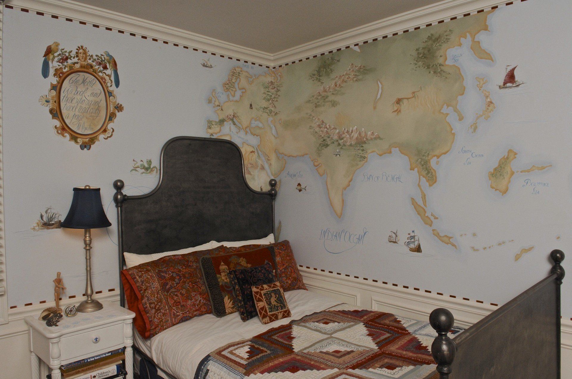 A bedroom with a bed and a map on the wall